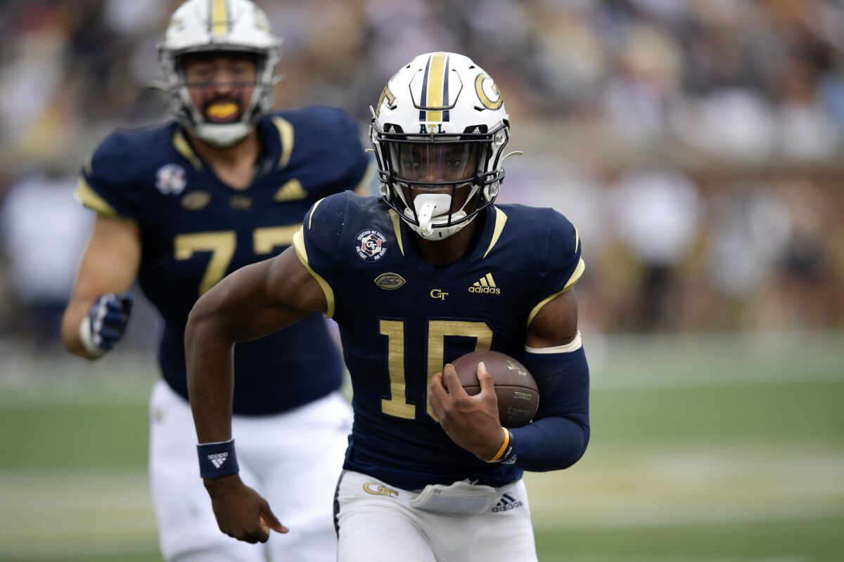 Georgia Tech quarterback Jeff Sims (10) runs out of the pocket against Pittsburgh during the first half of an NCAA college football game, Saturday, Oct. 2, 2021, in Atlanta. (AP Photo/Mike Stewart)