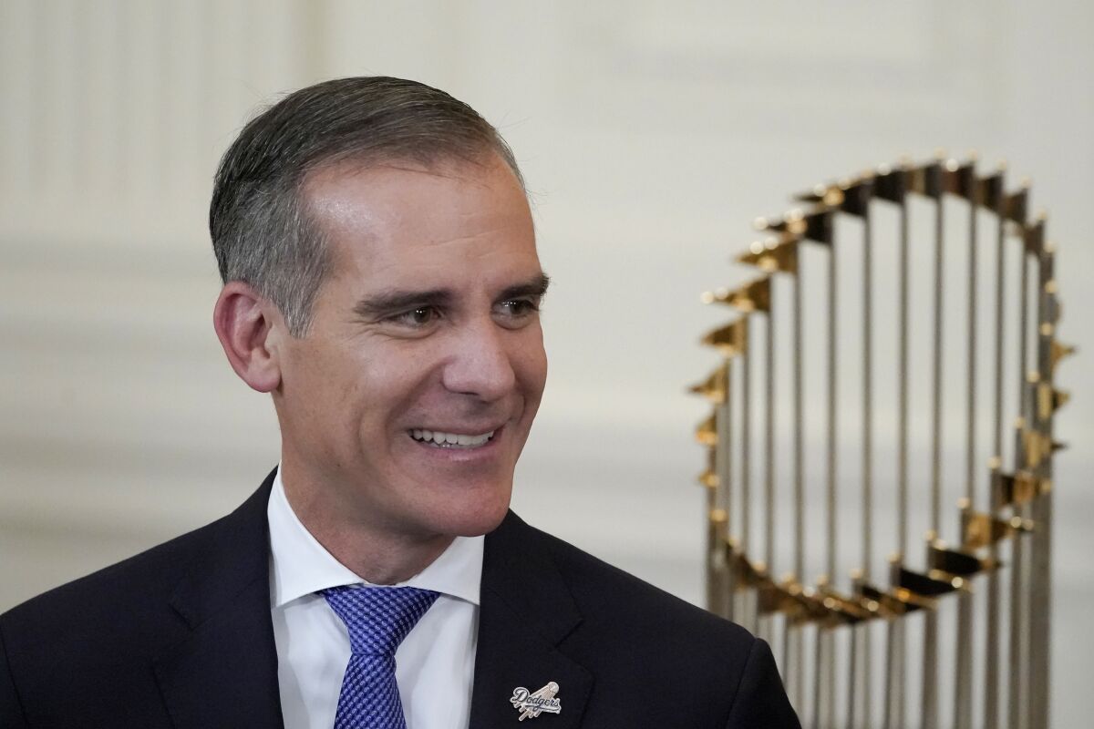 FILE - Los Angeles Mayor Eric Garcetti arrives for an event to honor the 2020 World Series champion Los Angeles Dodgers baseball team at the White House, July 2, 2021, in Washington. Testifying on Capitol Hill, Los Angeles Mayor Eric Garcetti again disputed Tuesday, Dec. 14, 2021, that he ever witnessed a former top adviser sexually harassing one of his police bodyguards, allegations that are the center of a lawsuit filed against his administration. The Democratic mayor's statement came during questioning from members of the U.S. Senate Foreign Relations Committee, which is considering Garcetti's nomination to become ambassador to India. (AP Photo/Julio Cortez, File)