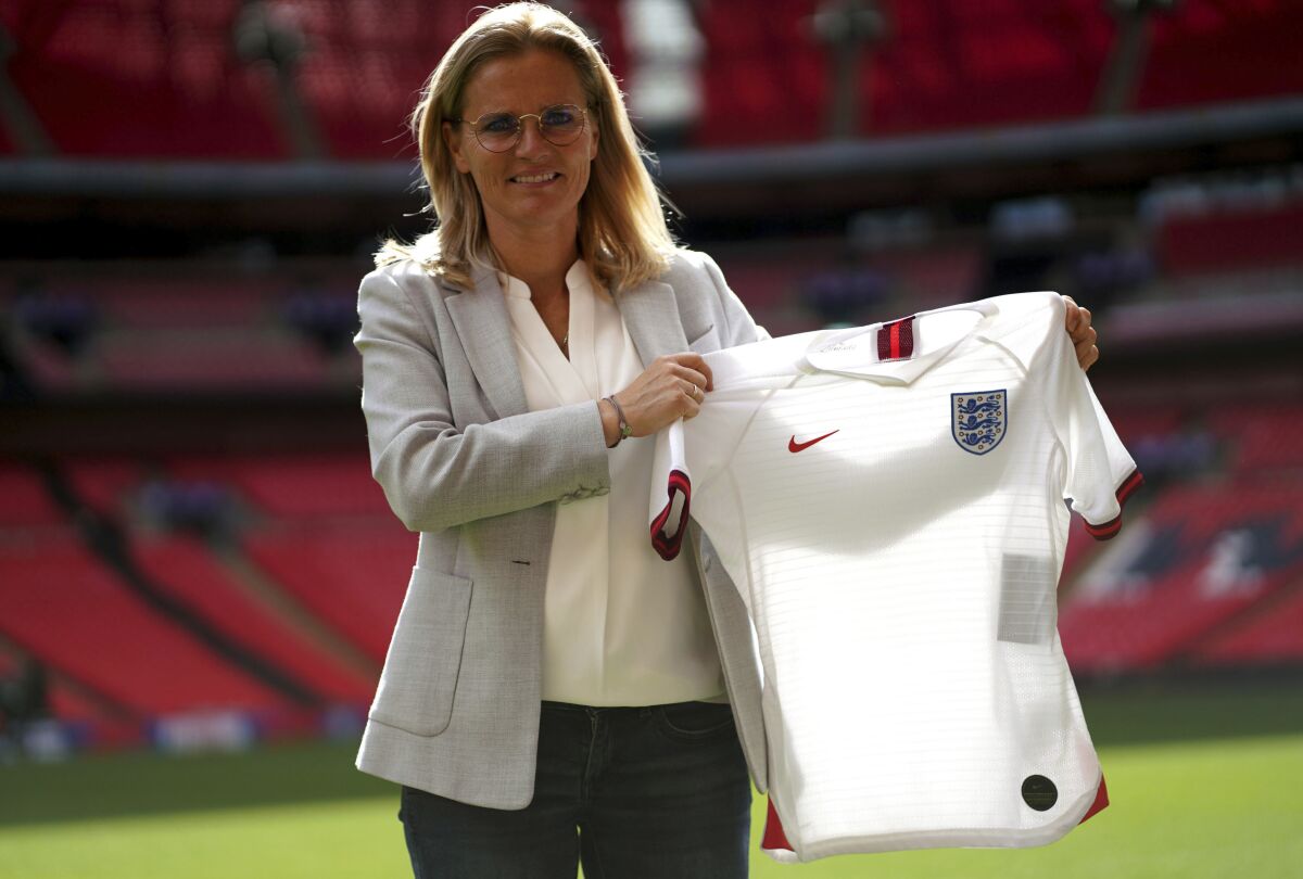 Sarina Wiegman is unveiled as the new England Women head coach at Wembley Stadium, London, Thursday, Sept. 9, 2021. Setting out on her vision as England manager, Sarina Wiegman was sure of one thing — the Women's World Cup should remain every four years. “The Euros are great, the World Cup is great, the Olympics are great so that is three tournaments," she said, pitchside at Webmley Stadium on Thursday. (Adam Davy/PA via AP)