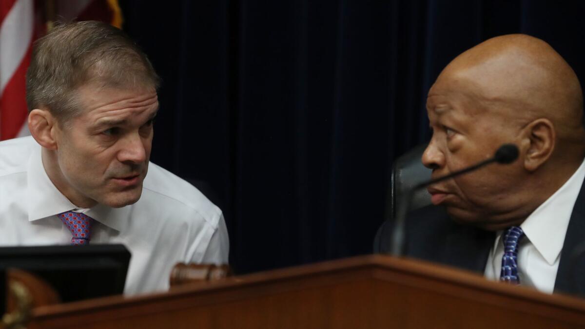 Rep. Jim Jordan (R-Ohio), left, and Chairman Elijah Cummings (D-Md.) at a House Oversight and Reform Committee hearing on March 14.
