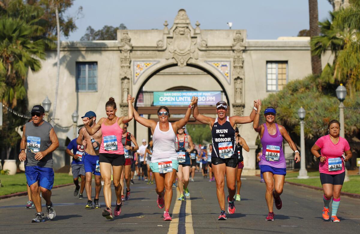 Runners in the America's Finest City Half Marathon make their way through Balboa Park.(Photo by K.C. Alfred/The San Diego Union-Tribune)