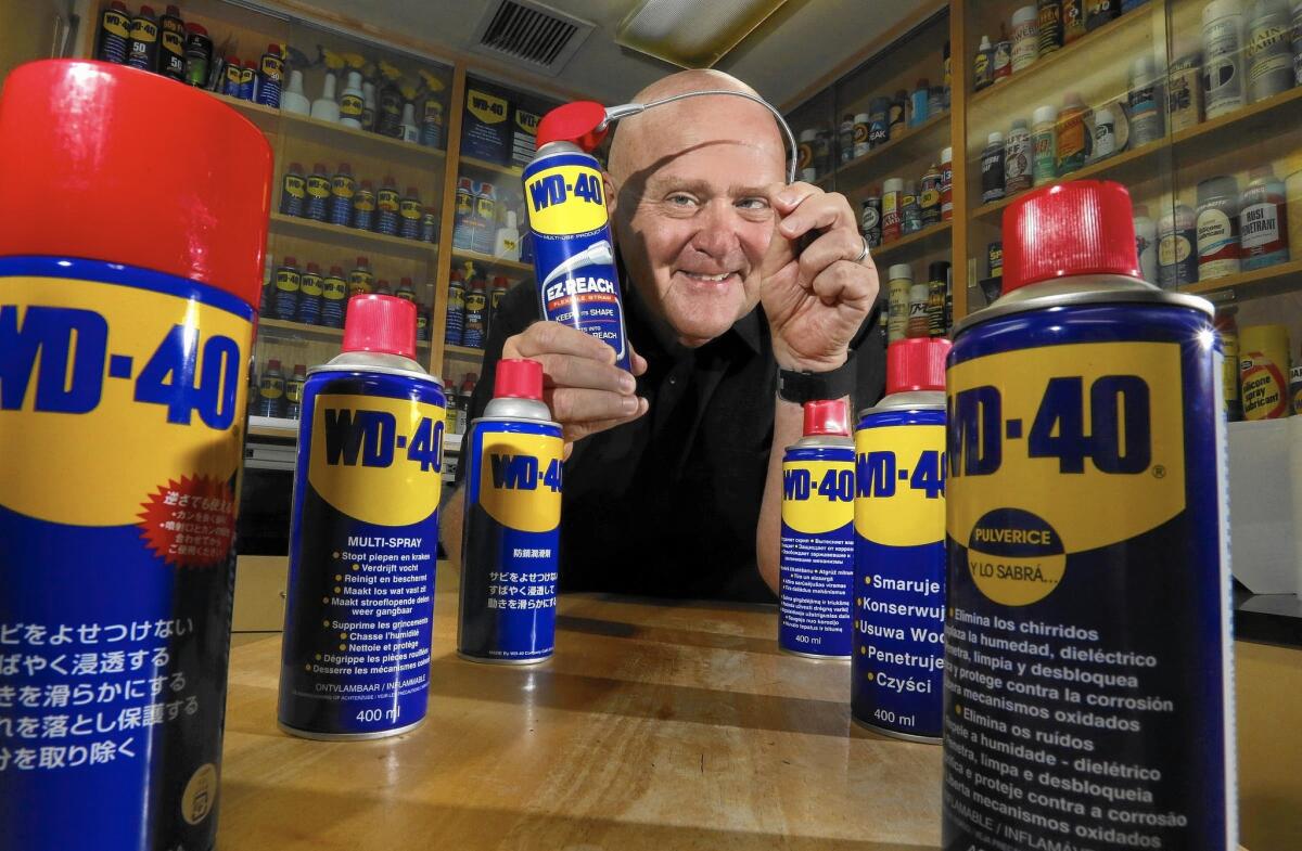 Garry Ridge, chief executive of WD-40, amid aerosol cans of his product at the company's San Diego headquarters.