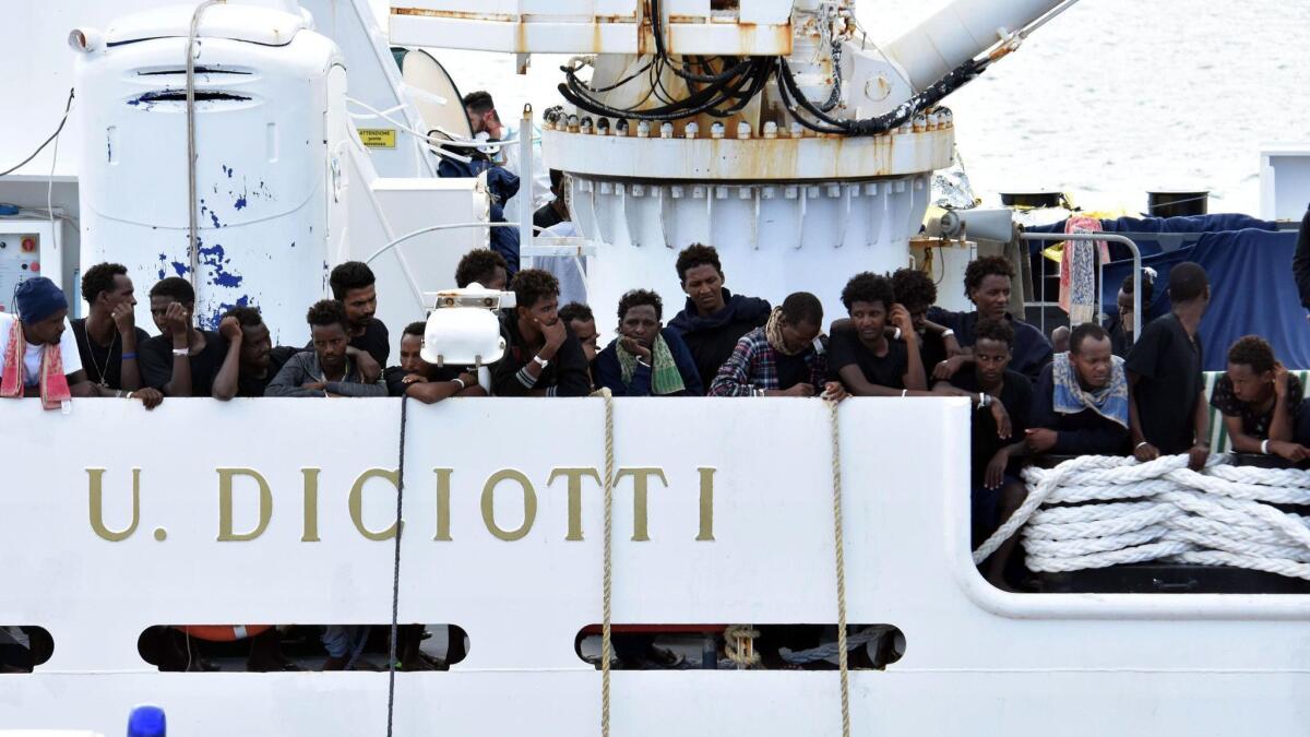 The Italian premier says the Italian Catholic church will take most of the 140 migrants who have been stuck aboard an Italian coast guard ship for days, thus ending a standoff between Italy and the European Union over the migrants’ fate.