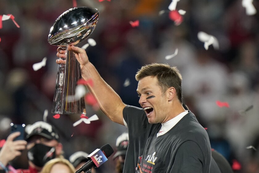Tampa Bay Buccaneers quarterback Tom Brady celebrates with the Vince Lombardi Trophy after the NFL Super Bowl 