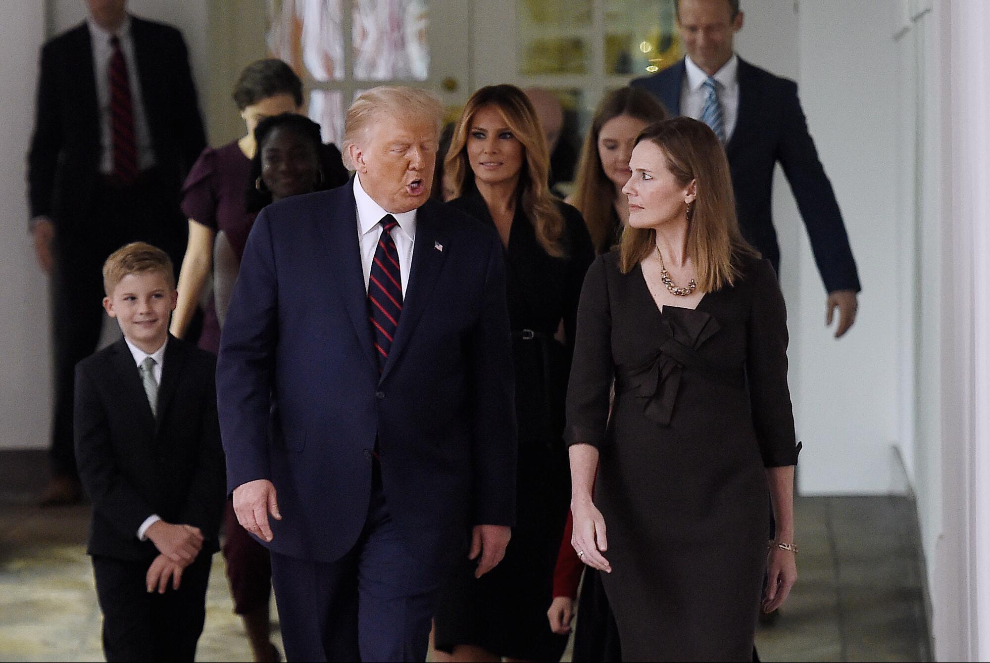 President Trump and Judge Amy Coney Barrett before he introduced her as his Supreme Court pick