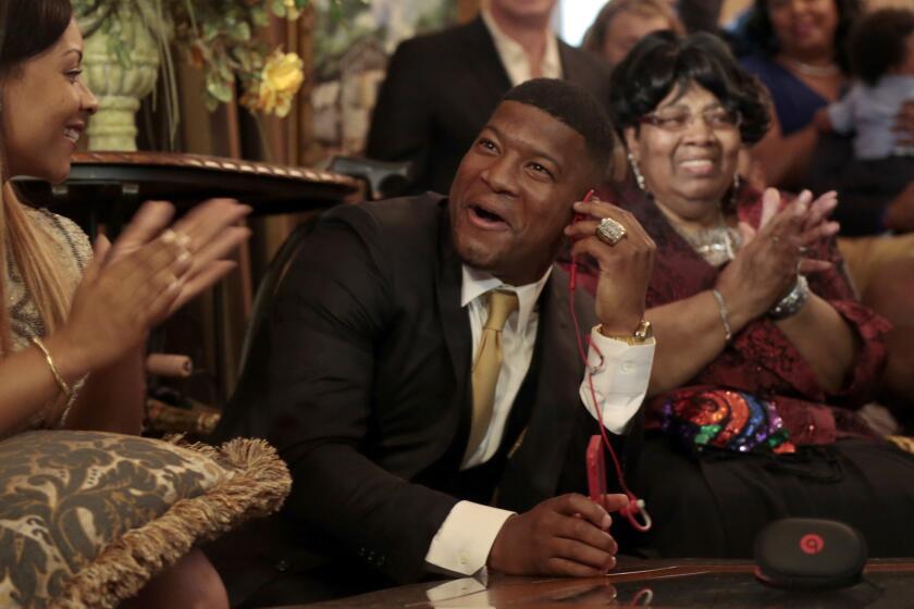 Jameis Winston reacts with his family and friends as he takes the call from the Tampa Bay Buccaneers informing him they are selecting him as the No. 1 overall draft pick Thursday night in Bessemer, Ala.