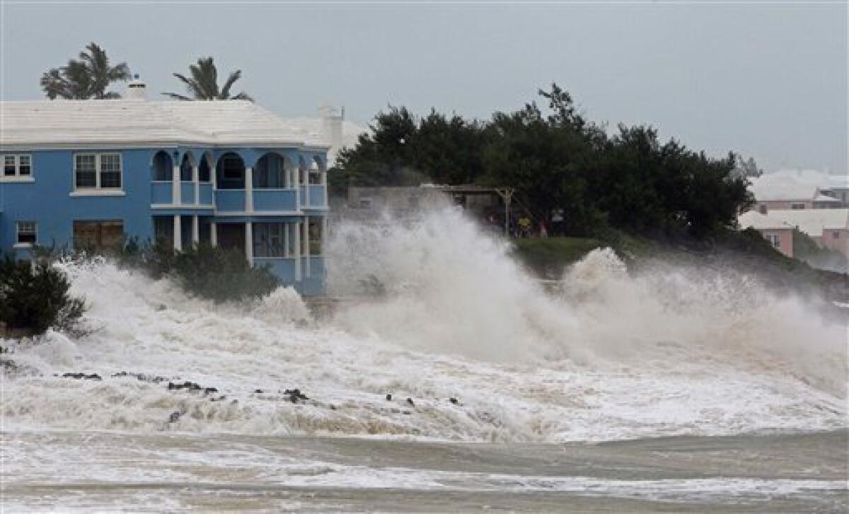 Waves crash onto the beach at John Smith's Bay in Smith's Parish as Hurricane Igor approaches in Bermuda, Saturday, Sept. 18, 2010. The National Hurricane Center in Miami said tropical storm winds will start battering Bermuda Saturday night, with the hurricane expected to pass near Bermuda early Monday. (AP Photo/Gerry Broome)