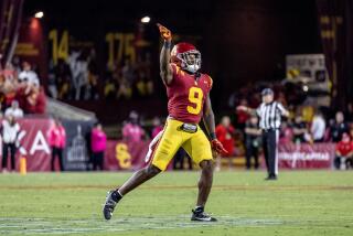 LOS ANGELES, CA - OCTOBER 21, 2023: USC Trojans linebacker Raesjon Davis (9) reacts towards the sidelines after a defensive stop on Utah in the second half at LA Memorial Coliseum on October 21, 2023 in Los Angeles, California.(Gina Ferazzi / Los Angeles Times)