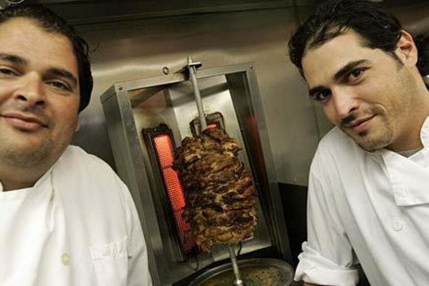 Bar-B-Kosher is owned and operated by the Dahan brothers, David, left, and Assi.