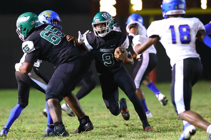 Dorsey running back Jamarion Broughton follows a block through the line of scrimmage in a win over Crenshaw on Friday night.