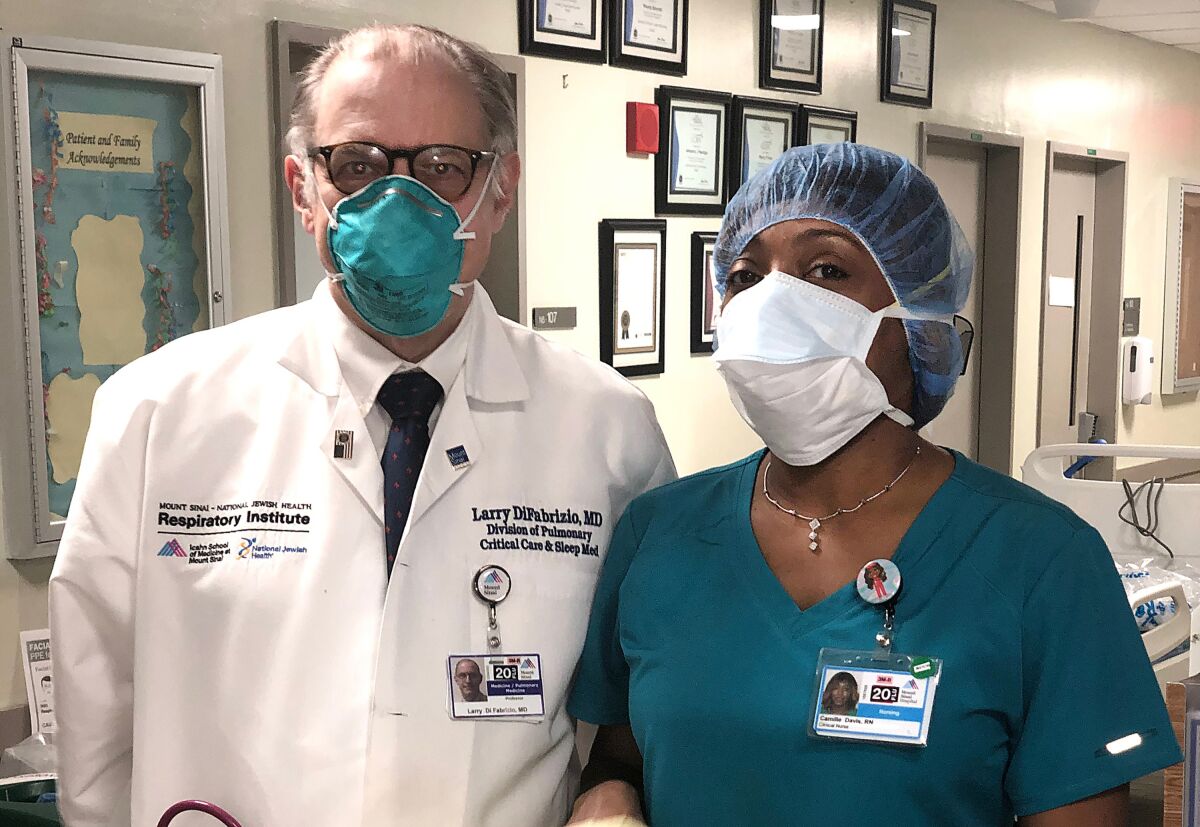 Dr. Larry Di Fabrizio and nurse Camille Davis of Mt. Sinai in their personal protection equipment (PPE).