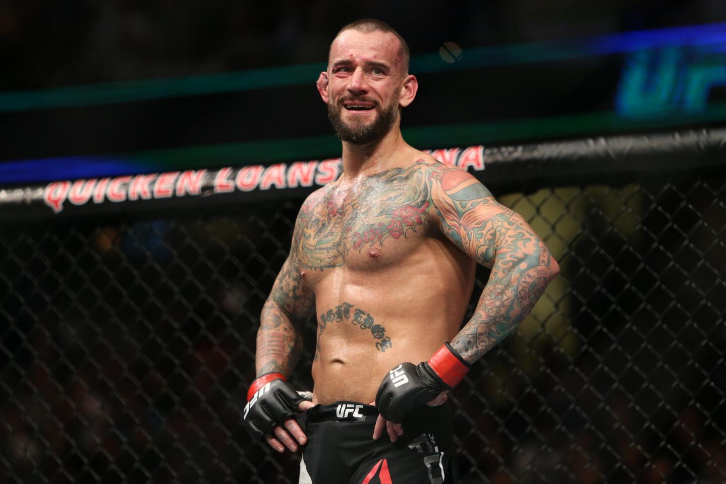 CM Punk reacts to his loss by submission to Mickey Gall on Sept. 10 at UFC 203 in Cleveland.