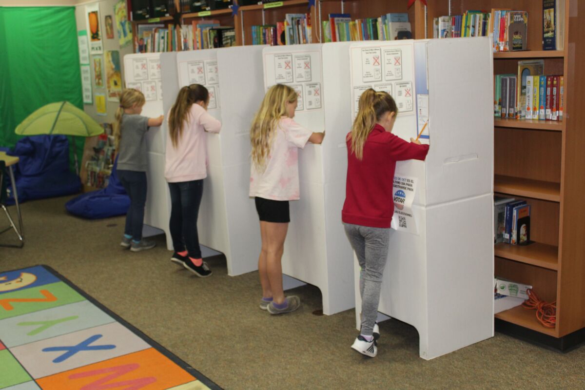 Third graders cast their vote in the election.