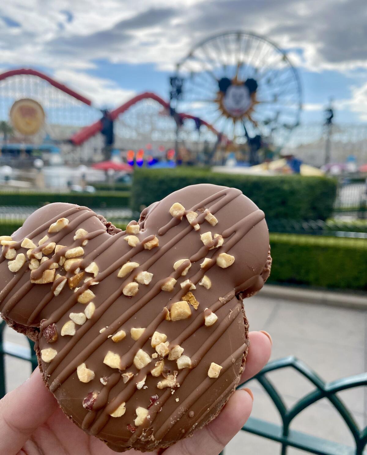 A Snickers caramel-peanut milk chocolate Mickey Macaron at Disney California Adventure Food & Wine Festival.