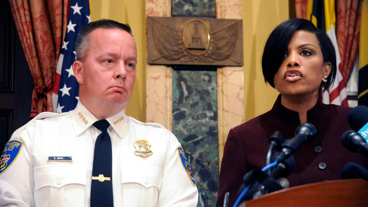 Baltimore Police Commissioner Kevin Davis and Mayor Stephanie Rawlings-Blake at a news conference at City Hall on Aug. 10.