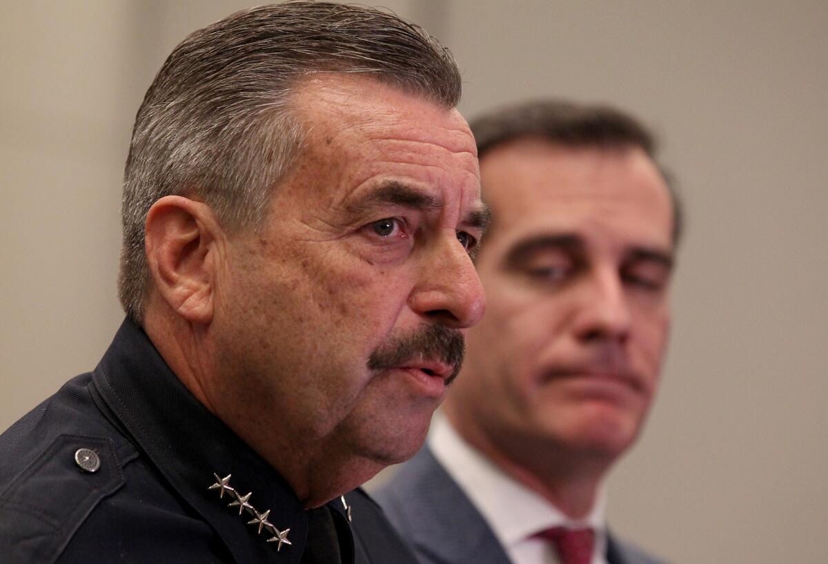 LAPD Chief Charlie Beck, pictured with Mayor Eric Garcetti at a news conference last week, revealed new details Tuesday about the fatal police shooting of a 16-year-old in Boyle Heights, saying the teen had a sawed-off shotgun.