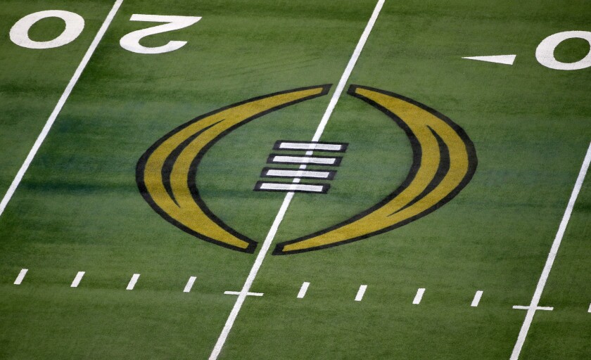 FILE - The College Football Playoff logo is shown on the field at AT&T Stadium before the Rose Bowl NCAA college football game between Notre Dame and Alabama in Arlington, Texas, Jan. 1, 2021. The most positive development at the latest meeting on expanding the College Football Playoff was that the people involved agreed to keep talking. There is no firm date for the next meeting, but there is one regularly schedule for January around the College Football Playoff championship game. (AP Photo/Roger Steinman, File)