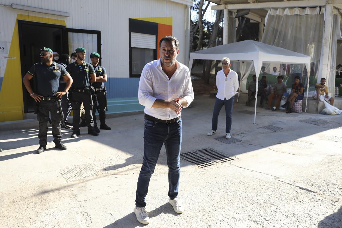 Matteo Salvini visits a migrant reception center.