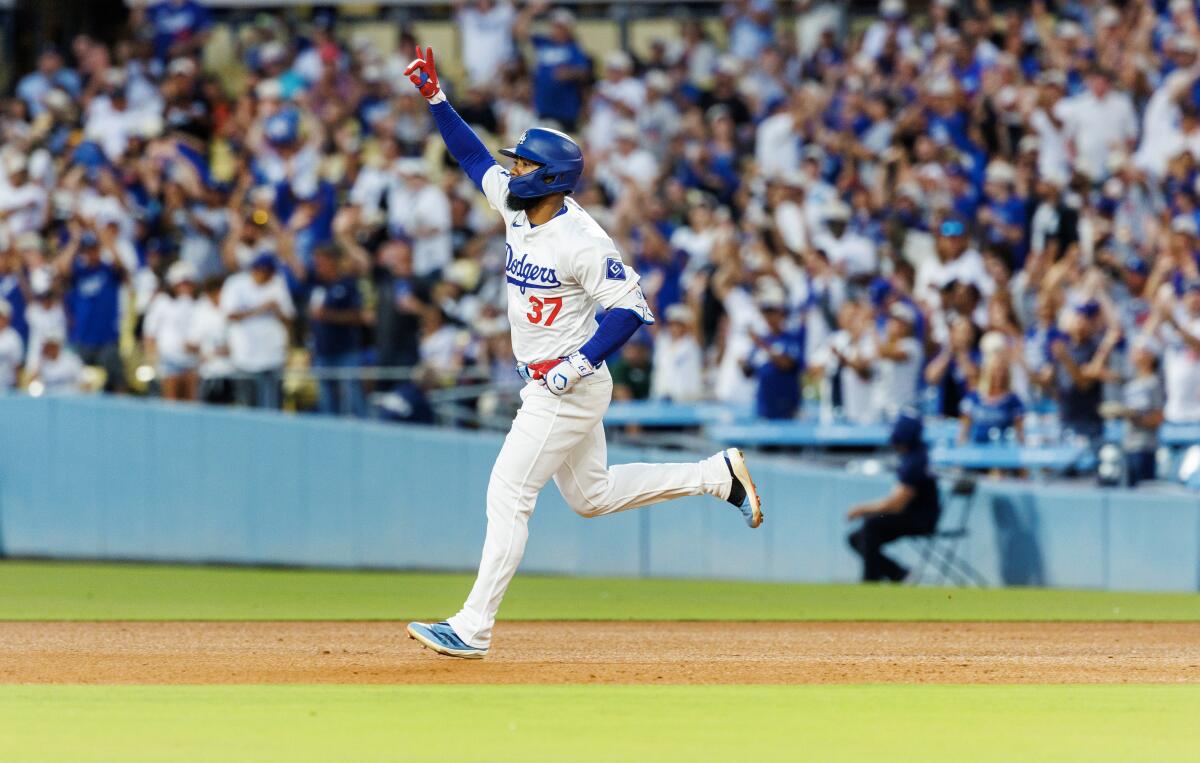 Teoscar Hernández runs the bases after hitting a solo home run in the fourth inning of the Dodgers' 3-2 win.
