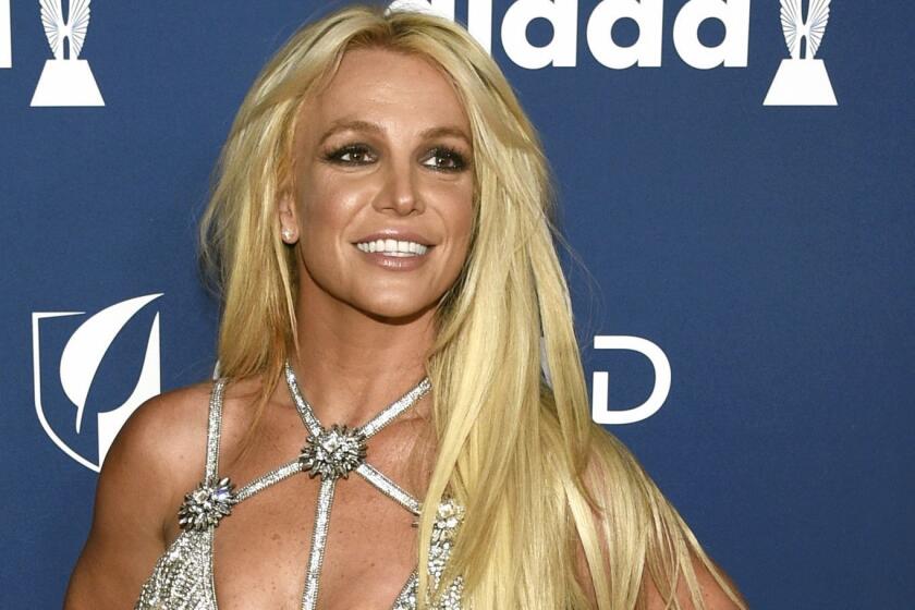 FILE - In this April 12, 2018 file photo, Britney Spears arrives at the 29th annual GLAAD Media Awards in Beverly Hills, Calif. Spears is putting her planned Las Vegas residency on hold to focus on her father's recovery from a recent life-threatening illness. The pop superstar announced Friday, Jan. 4, 2019 she is going on an indefinite work hiatus. (Photo by Chris Pizzello/Invision/AP, File)