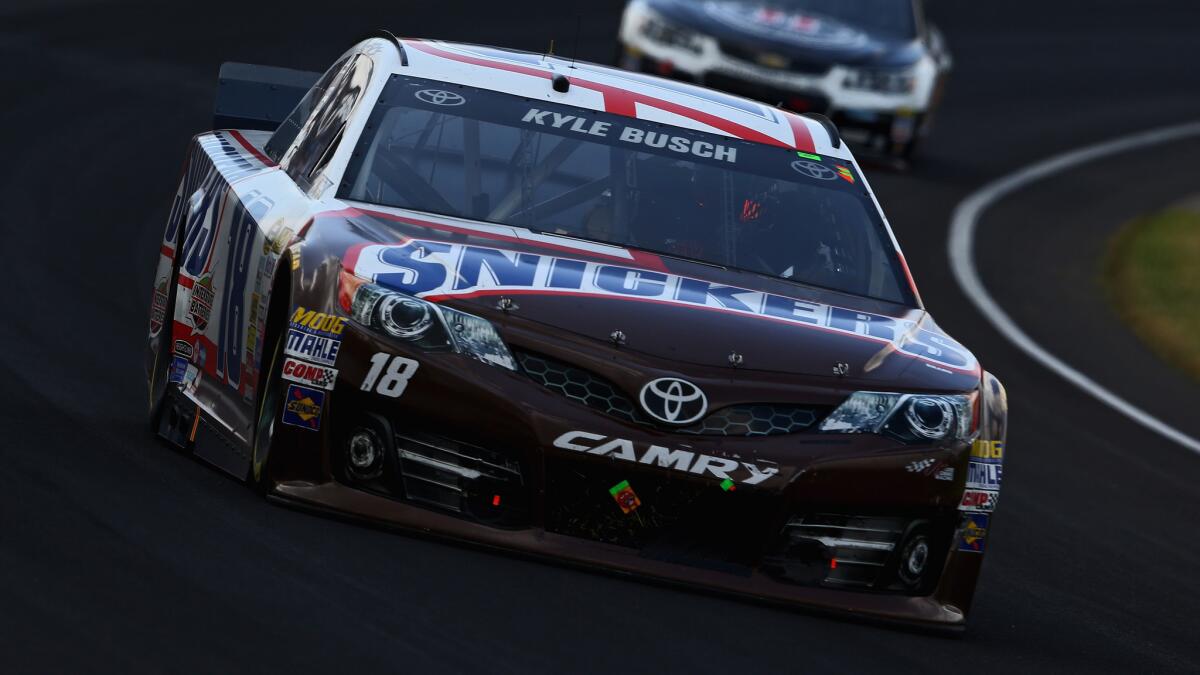 Kyle Busch drives to a second-place finish behind Jeff Gordon during the NASCAR Sprint Cup Series Brickyard 400 at Indianapolis Motor Speedway on Sunday.