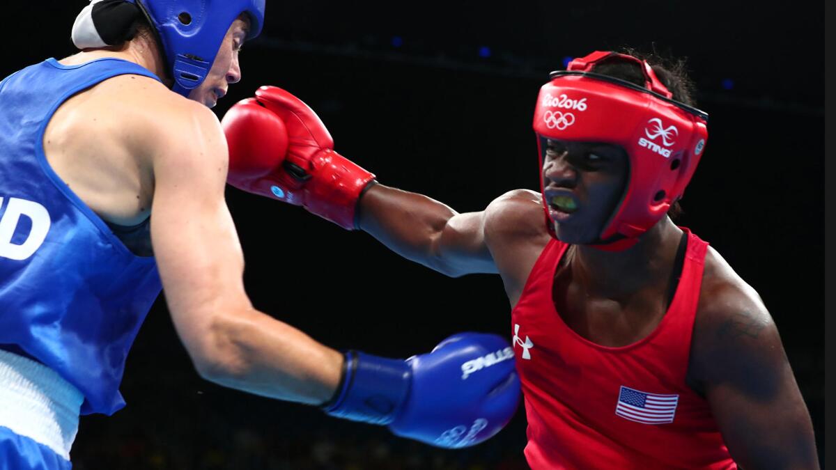 Claressa Shields fights her way to a gold medal over Nouchka Fontijn of the Netherlands.