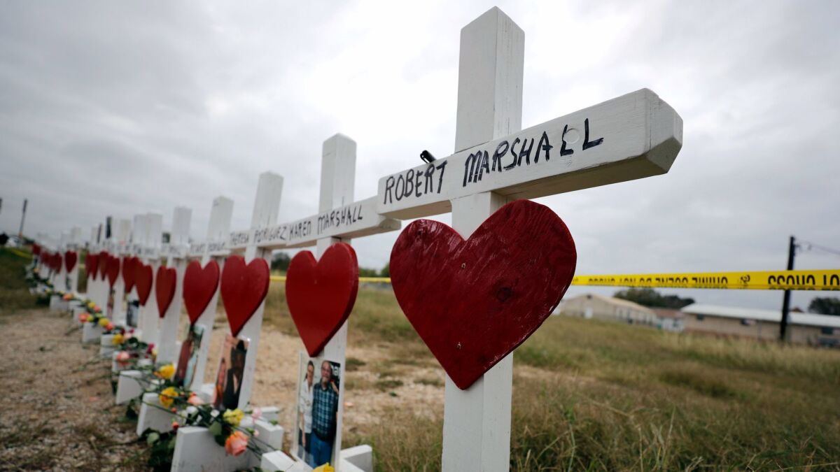 Crosses showing shooting victims' names stand near the First Baptist Church in Sutherland Springs, Texas, on Nov. 9.