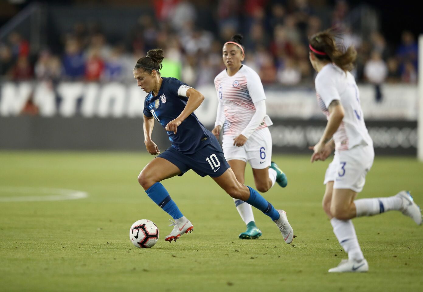 SAN JOSE, CA - SEPTEMBER 04: Carli Lloyd of the United States dribbles past Claudia Soto of Chile during their match at Avaya Stadium on September 4, 2018 in San Jose, California. (Photo by Ezra Shaw/Getty Images) ** OUTS - ELSENT, FPG, CM - OUTS * NM, PH, VA if sourced by CT, LA or MoD **