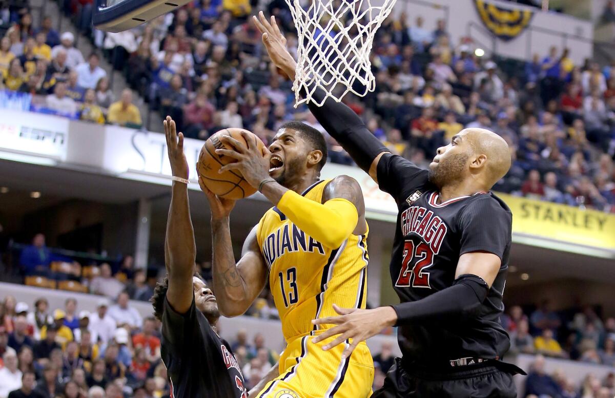 Indiana's Paul George goes up for a shot while being defended by Chicago's Taj Gibson during a Nov. 27 game in Indianapolis.