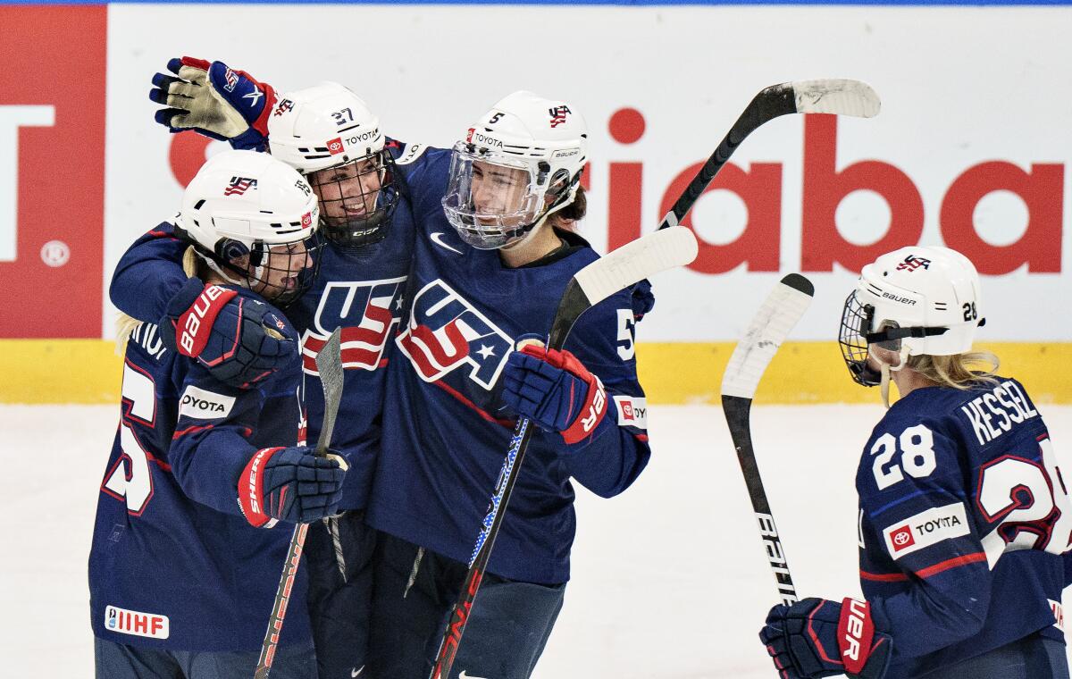 Taylor Heise celebrates with teammates after scoring against the Czech Republic.