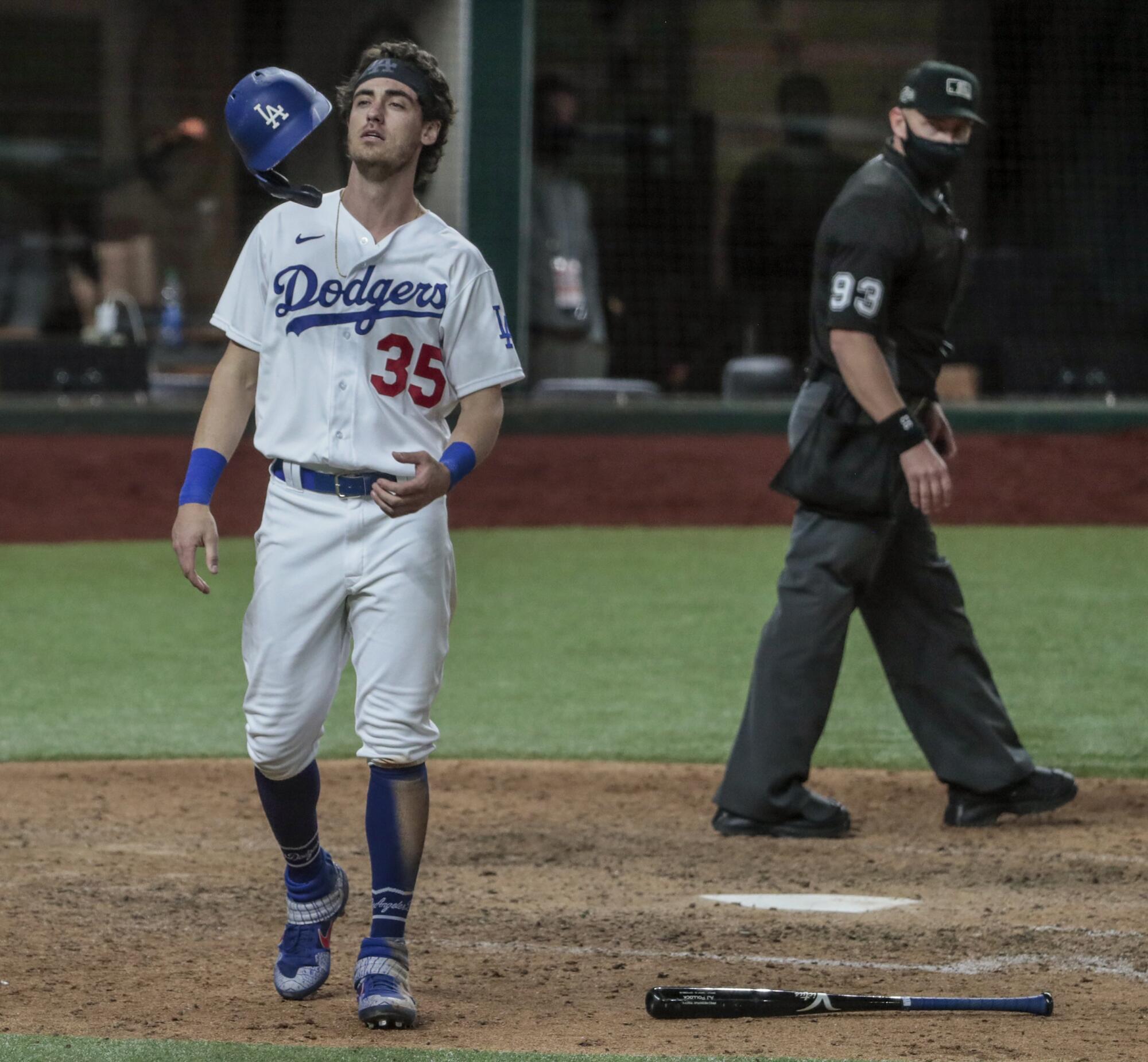 A frustrated Cody Bellinger tosses his helmet after AJ Pollock grounded out to end the game.