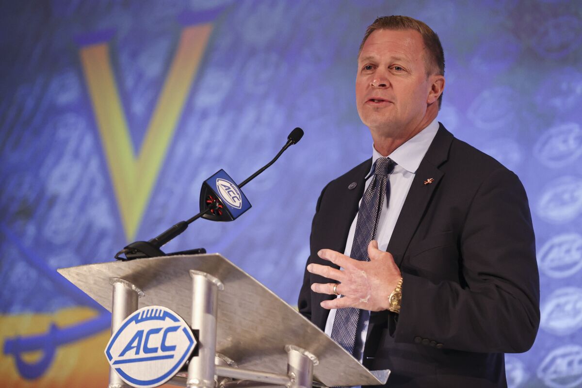 FILE - Virginia head coach Bronco Mendenhall answers a question during an NCAA college football news conference at the Atlantic Coast Conference media days in Charlotte, N.C., in this Wednesday, July 21, 2021, file photo. (AP Photo/Nell Redmond)