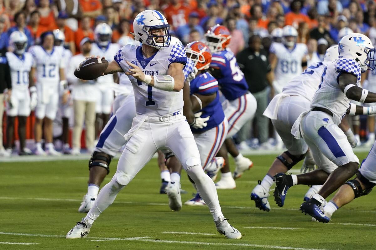 Kentucky quarterback Will Levis (7) looks for a receiver during the first half of an NCAA college football game against Florida, Saturday, Sept. 10, 2022, in Gainesville, Fla. (AP Photo/John Raoux)