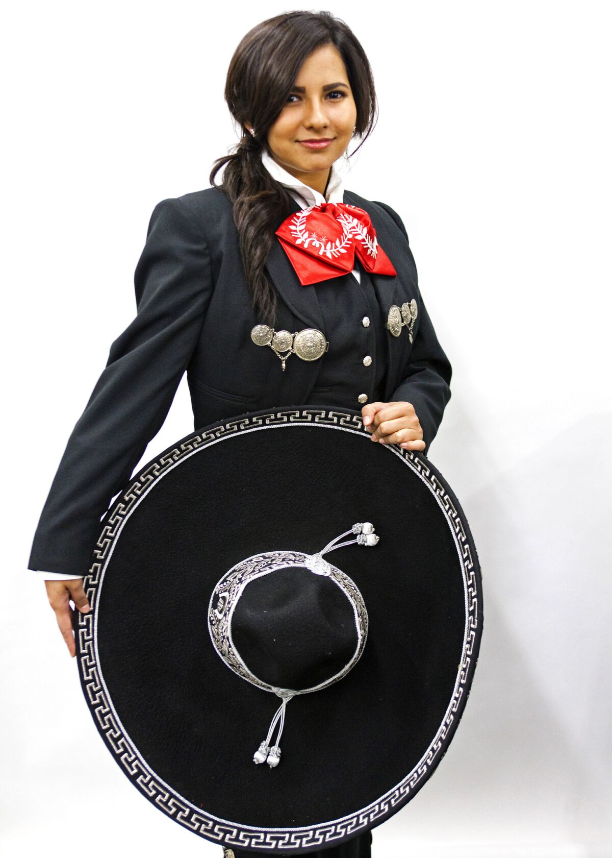 Mariachi Kaylee Guzman, 19, shows off her Tello-crafted suit.