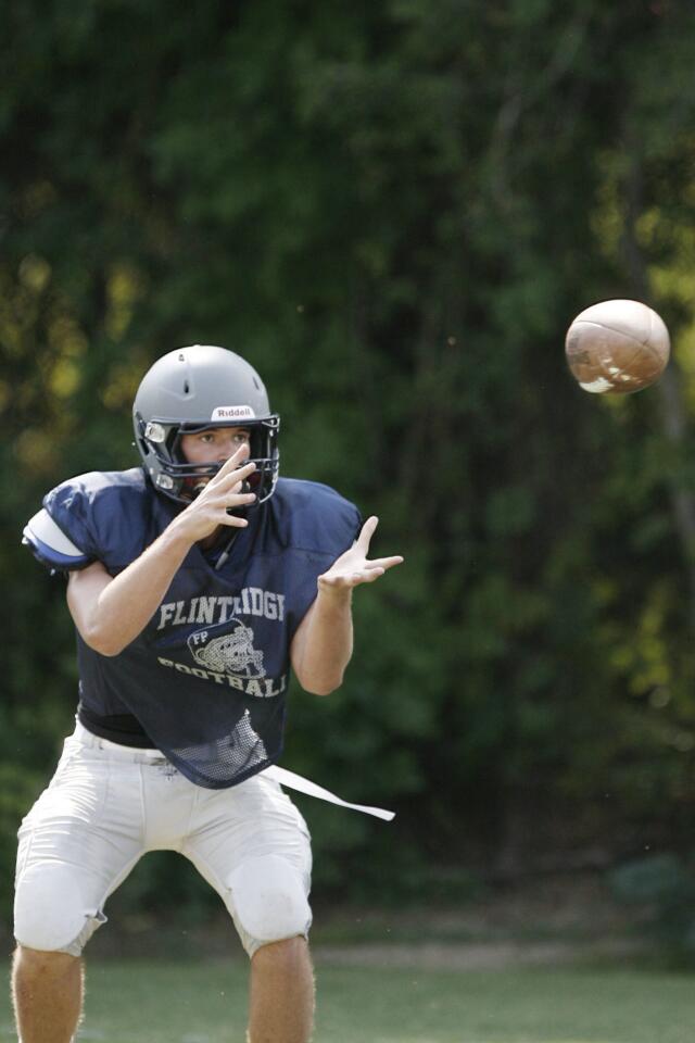 Flintridge Prep's Michael Leslie catches the ball during practice at Flintridge Prep in La Canada on Friday, August 17, 2012.