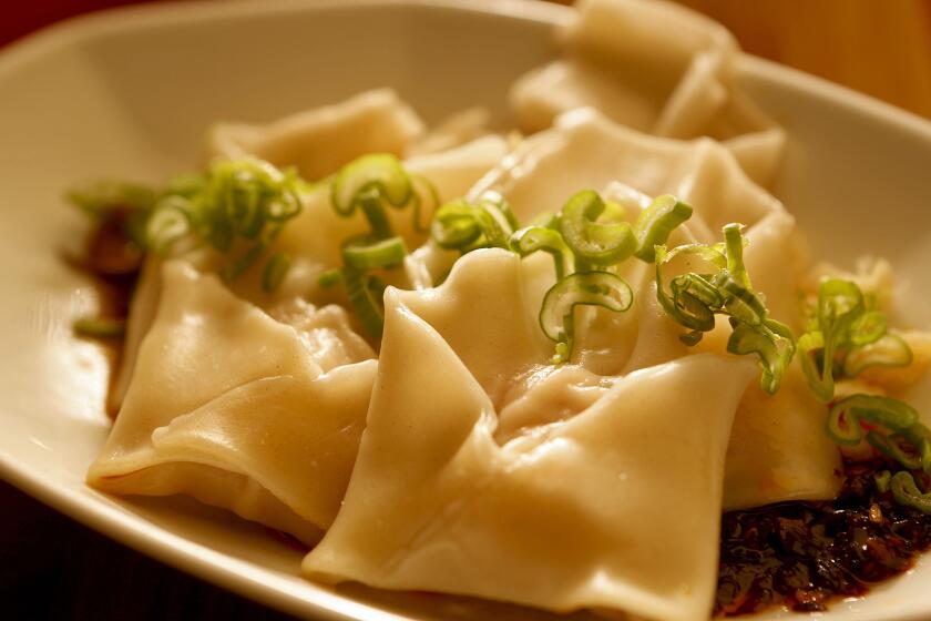 Making Sichuan wontons is more fun with friends.