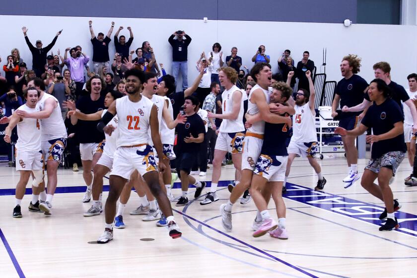 Orange Coast College men's volleyball team celebrate after winning the 2022 California Community College Athletic Association Men's Volleyball State Championship against Long Beach City College at El Camino College in Torrence on Saturday, April 23, 2022. (Photo by James Carbone)