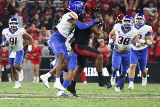 San Diego, CA - September 22: Boise State safety Rodney Robinson (4) tackles San Diego State wide receiver Brionne Penny (11) during their game at Snapdragon Stadium on Friday, Sept. 22, 2023 in San Diego, CA. (Meg McLaughlin / The San Diego Union-Tribune)