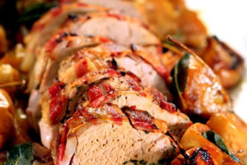 IT'S A WRAP: Bacon-wrapped pork loin with roasted apples.