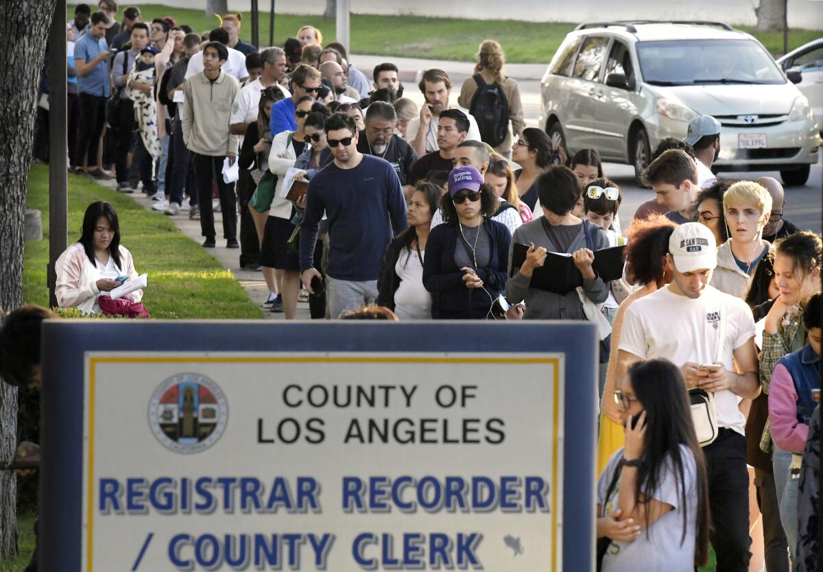 Voters wait in long lines to cast their ballots at the Los Angeles County Registrar's office.