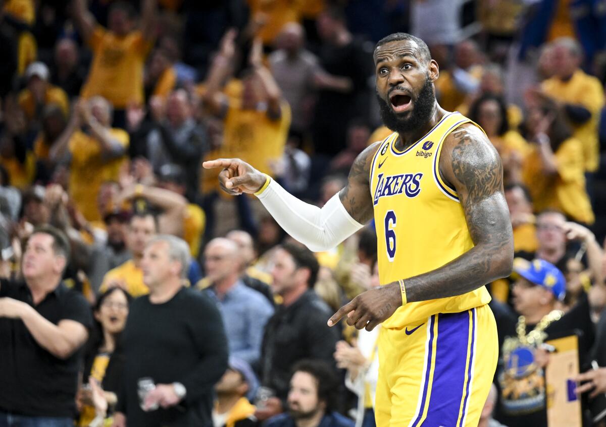 Lakers forward LeBron James yells to a teammate on the court during the fourth quarter of Game 1.