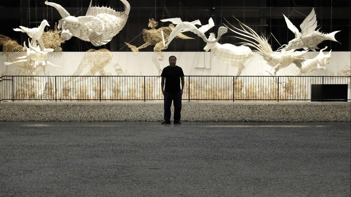 Artist Ai Weiwei looks over his 2018 installation at the Marciano Art Foundation.