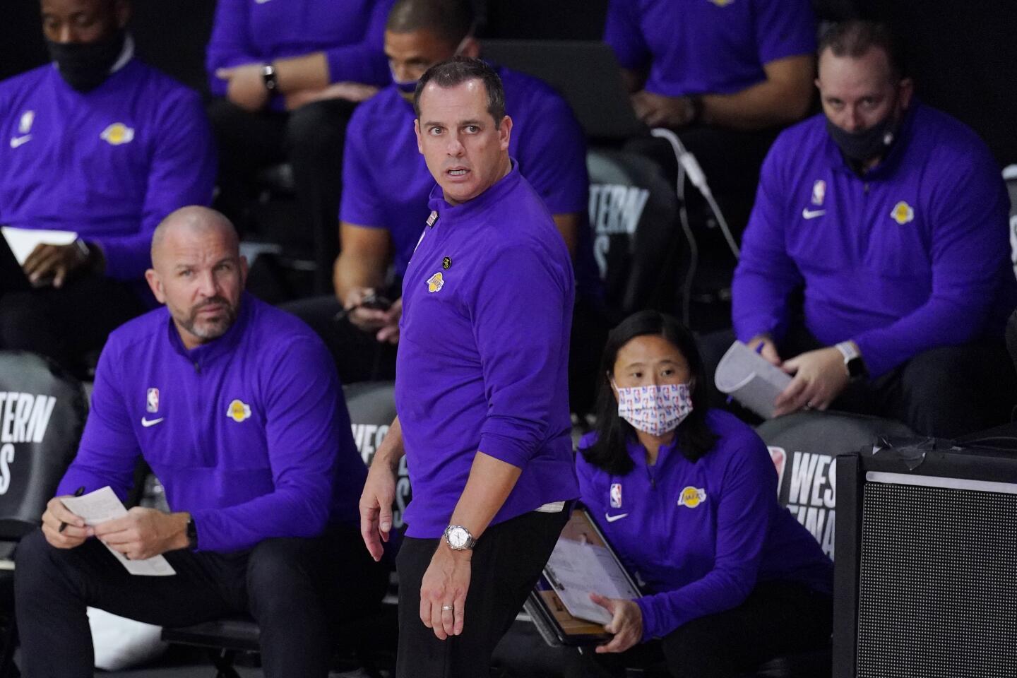 Lakers head coach Frank Vogel, center, watches the action during the first half of Saturday's NBA conference final playoff.