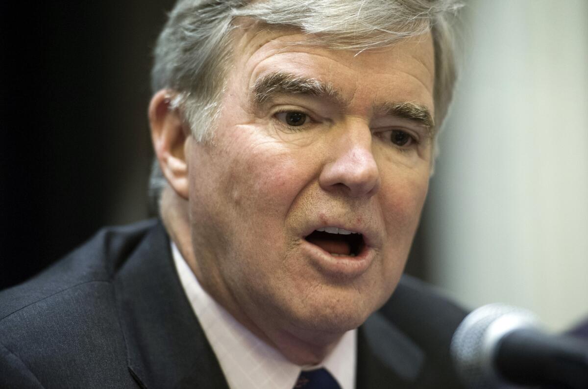 NCAA President Mark Emmert speaks during a news conference Friday announcing a settlement with Penn State that will give the school back 112 wins wiped out during the Jerry Sandusky molestation scandal.