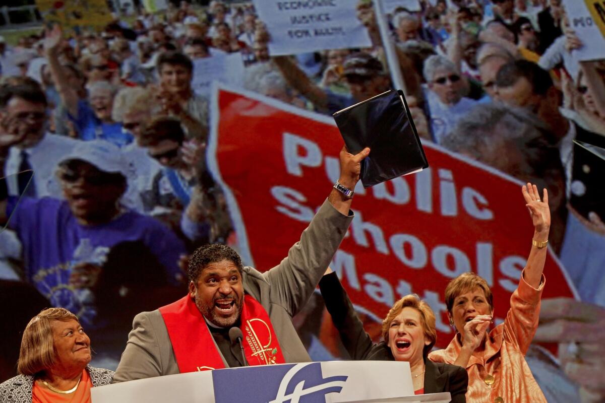 The Rev. Dr. William Barber II, second from left, wraps up his speech as AFT secretary-treasurer at the convention.