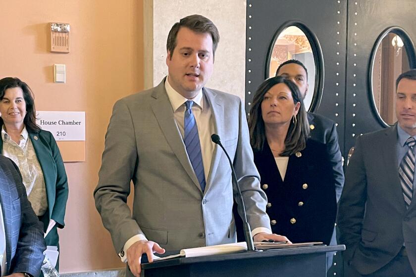 FILE - Ohio state Rep. Derek Merrin talks to reporters on Feb. 15, 2023, in Columbus, Ohio. Republicans are watching two hot-button federal races in Ohio on Tuesday, March 19, 2024, that could affect their chances for potentially pivotal pickups this fall. The Toledo-area congressional primary includes Merrin and former state Rep. Craig Riedel. Merrin joined the congressional race on the filing deadline, after audio that surfaced of Riedel criticizing Trump began raising concerns inside the party about his electability. (AP Photo/Samantha Hendrickson, File)