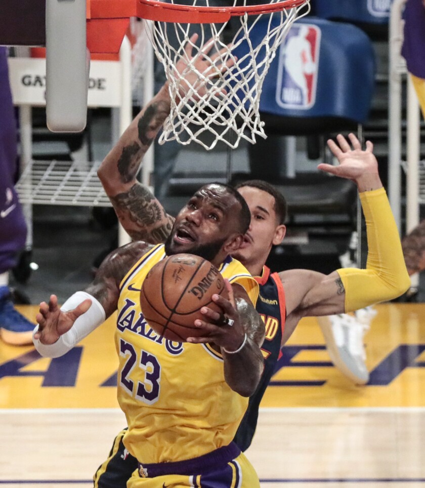 LeBron James drives to the basket during the Lakers' play-in game against the Golden State Warriors
