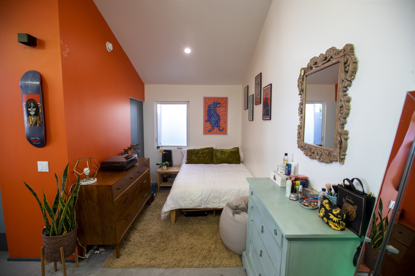 A look into the bedroom, which features a small closet in the back.