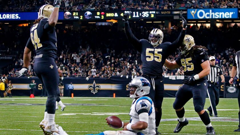 New Orleans Saints linebacker Jonathan Freeny (55) celebrates his sack of Carolina Panthers quarterback Cam Newton on a third down, forcing the Panthers to kick a field goal, in the second half.