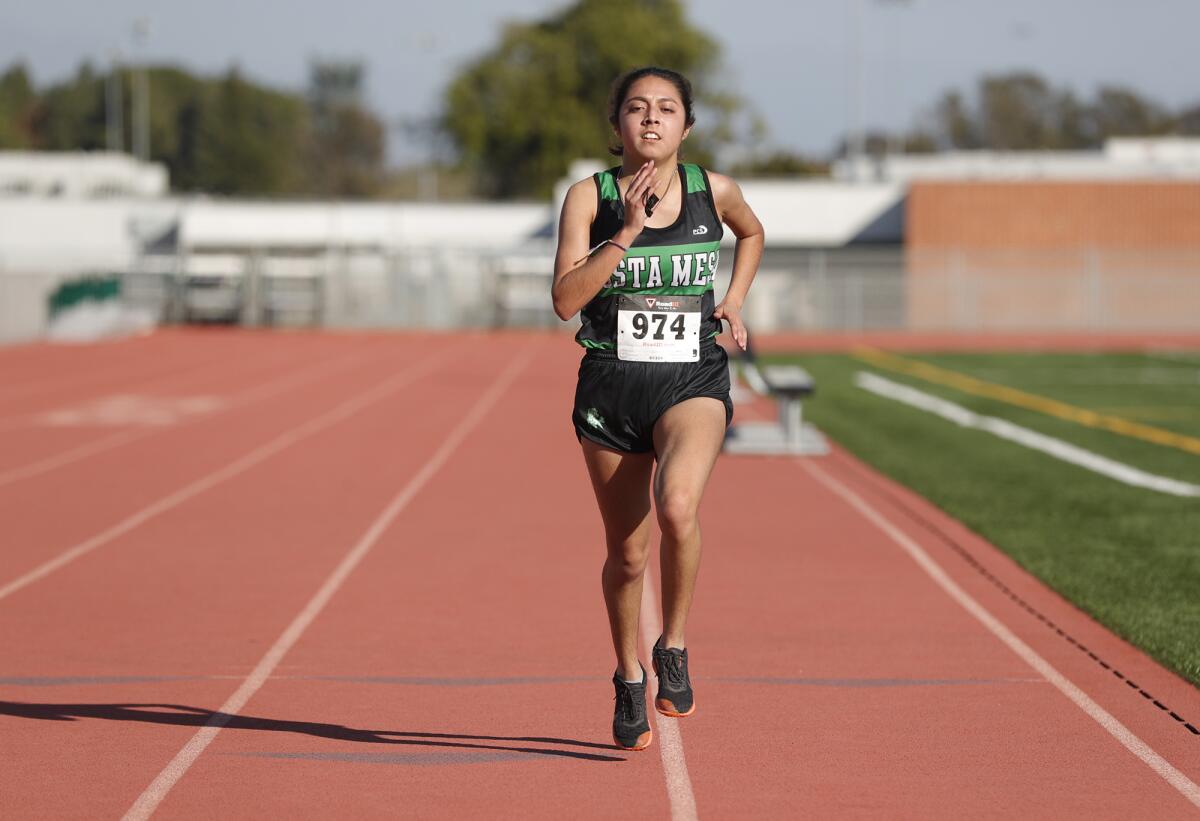 Costa Mesa's Jaqueline Rodriquez wins the girls' varsity race 